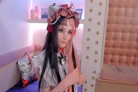 ladyboy Cosplayer Puts Rubber rod Up To The face hole